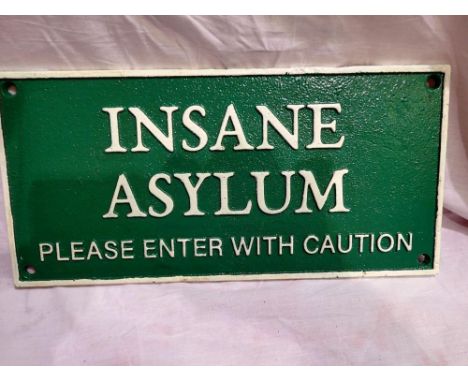 Cast iron Insane Asylum sign, W: 30 cm. P&amp;P Group 1 (£14+VAT for the first lot and £1+VAT for subsequent lots) 