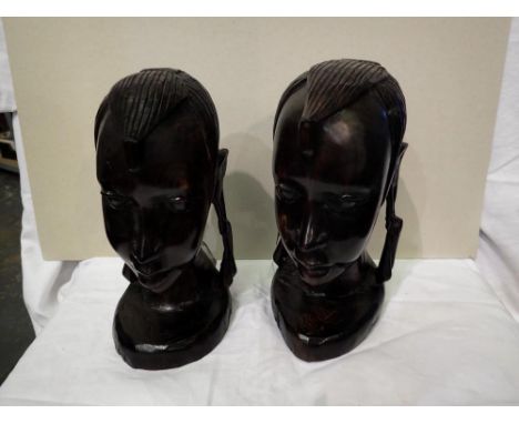 Pair of African carved native heads, H: 24 cm. P&amp;P Group 3 (£25+VAT for the first lot and £5+VAT for subsequent lots) 