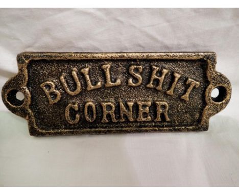 Cast iron bronzed Bull**** corner plaque, W: 10 cm. P&amp;P Group 1 (£14+VAT for the first lot and £1+VAT for subsequent lots