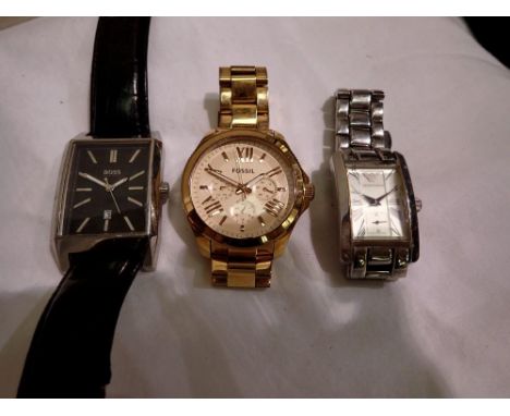 Three watches to include Boss, Armani and a gold plated Fossil. P&amp;P Group 1 (£14+VAT for the first lot and £1+VAT for sub
