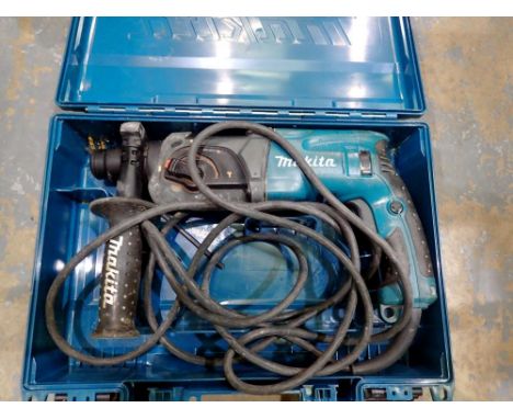Boxed Makita HR2470 electric 230-240v hammer drill with various settings. All electrical items in this lot have been PAT test