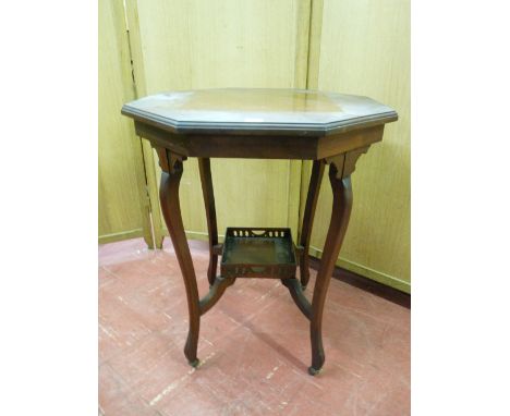 AN EDWARDIAN MAHOGANY OCTAGONAL TOPPED OCCASIONAL TABLE with galleried base shelf
