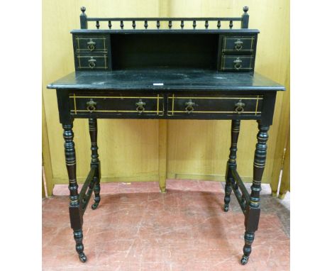 AN EDWARDIAN EBONIZED MAHOGANY SMALL WRITING DESK having a galleried and shelf back with two small drawers at each end, a too