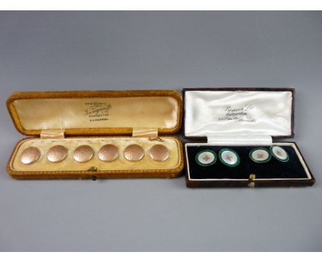 A SET OF SIX CIRCULAR NINE CARAT BEATEN GOLD BUTTONS with back loops in a Finnigans of Manchester box together with a boxed s
