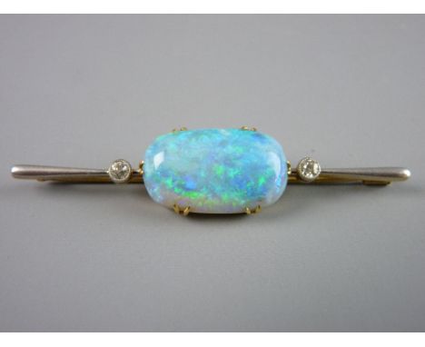 AN EXTREMELY IMPRESSIVE FIFTEEN CARAT GOLD BAR BROOCH having a centre oval opal approximately 23 x 14 mm and flanked either s