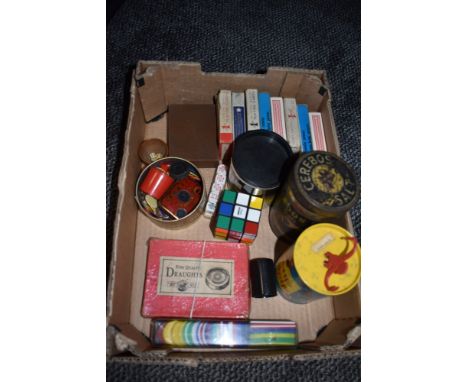 A selection of games and playing cards including Rubix cube