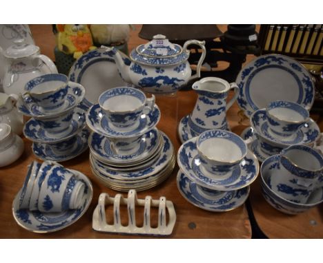A part tea service in blue and white with Chinese dragon design