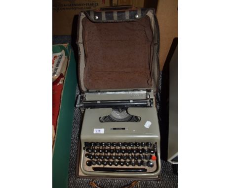 A vintage Olivetti portable type writer.