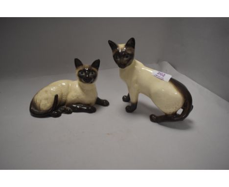 Two ceramic figures of Siamese cats by Royal Doulton