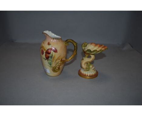 Two pieces of Royal Worcester, a green stamp sea monster and shell comport and a hand decorated jug in blush ivory