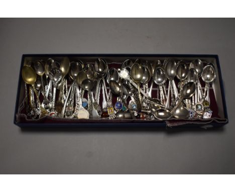 A selection of collectable souvenir tea spoons some with enamel crest