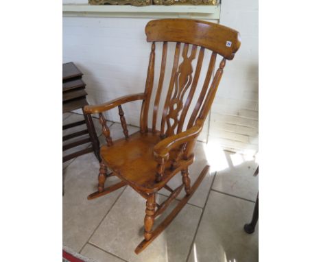 A 19th Century ash and elm stick back rocking chair 