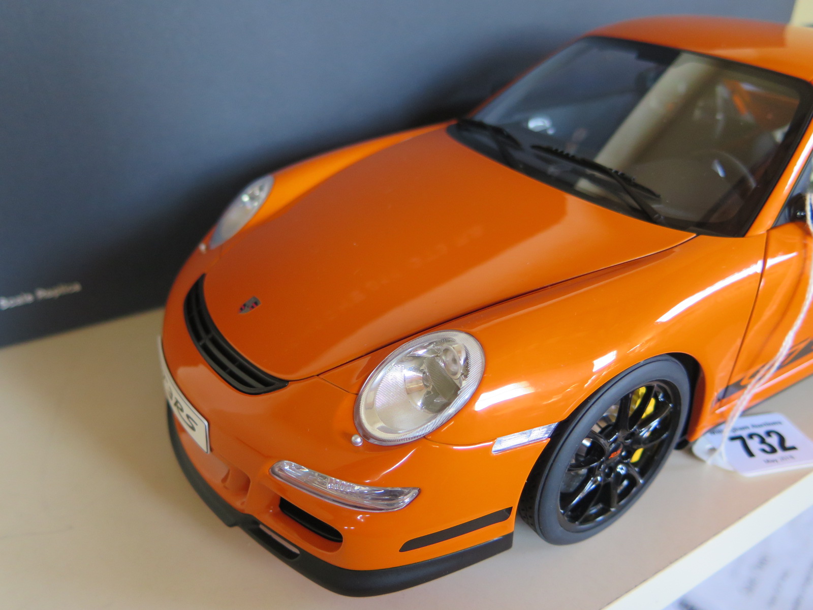 An Autoart 1/12 scale, diecast, Porsche 911 GT3 RS, with original box, model in as new condition