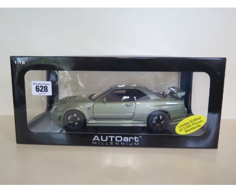 An Autoart Millenium die-cast 1:18 scale model of a Nismo R34 GTR Ztune car, with presentation stand and original box, as new