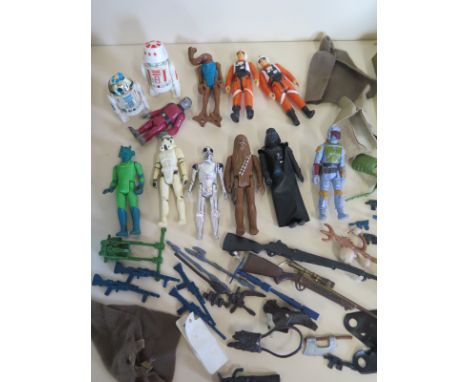 A collection Star Wars action figures, a 1977 Darth Vader made in Hing Kong with vinyl cloak but missing light sabre, a 1977 