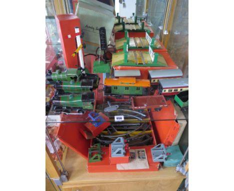 A Hornby O gauge tinplate tram set with three locos, rolling stock to include an NYC green/orange caboose 2528, an electric S