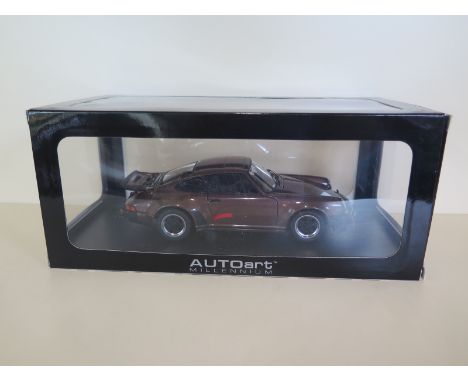 An Autoart Millennium 1:18 scale diecast model Porsche 911 Turbo 3.0, with original box and as new 