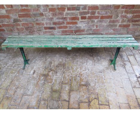 A small vintage green painted slated bench on metal supports Circa 1920 - 166cm W x 43cm H 