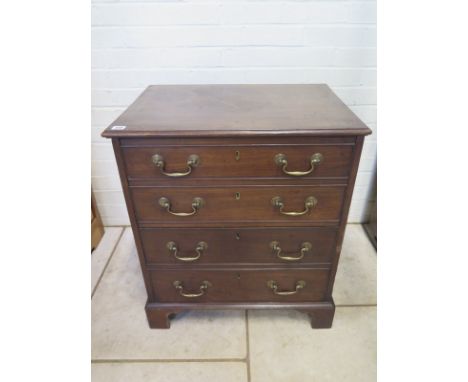 A Georgian mahogany commode in the form of a small four drawer chest 65cm W x 73cm H x 46cm D 