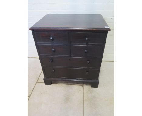 A 19th Century mahogany commode in the form of a small four drawer chest of drawers, 66cm W x 47cm D x 74cm H 