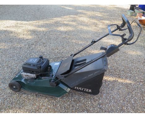 A Hayter Harrier 48 petrol lawn mower in working order with the owners manual 