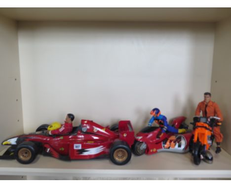 An Action man Formula 1 racing car, two motorbikes and three figures 