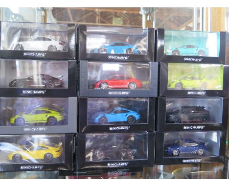 12 limited edition Minichamps, die-cast model cars, 1:43 scale, including nine various Porsche 911s, a BMW 1ER M Coupe and Fo