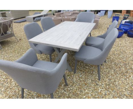 A Bramblecrest Monterey 155cm ceramic table with four side chairs and two armchairs in grey outdoor fabric 