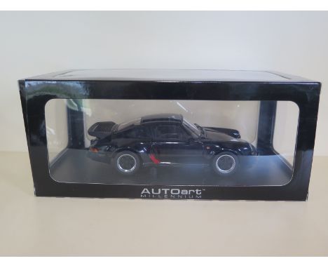 An Autoart Millennium diecast 1:18 scale, Porsche 911 Turbo 3.3 with presentation stand and original box, as new 