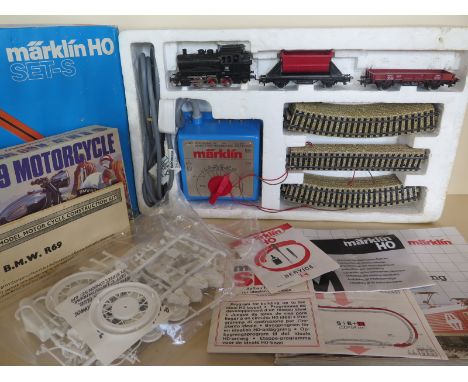 A Marklin HO train set 2934 with Loco, rolling stock, track, power supply together with an AIRFIX BMW R69 motor bike kit, wit