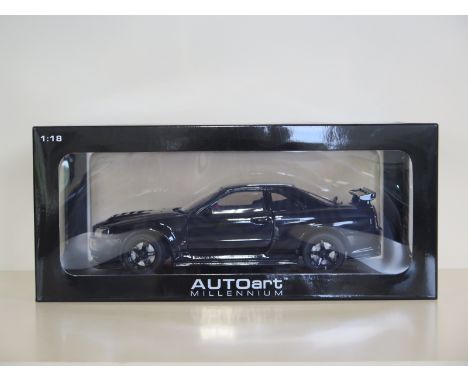 An Autoart Millennium 1:18 scale, die-cast model Nissan Nismo R34 GTR Z tune, with original box and as new 