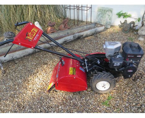 A Rally RYX 820 petrol rotavator in working order with its instruction manual 