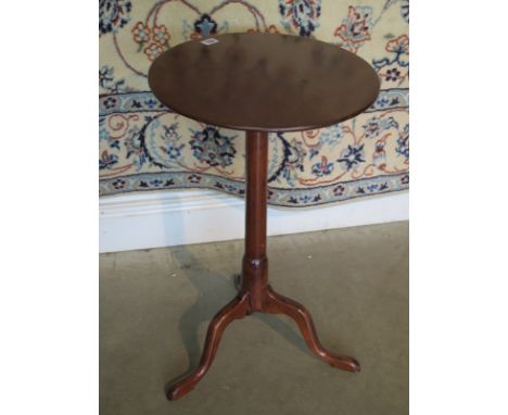 A mahogany wine table on a tripod base, 67cm tall, 42cm diameter 