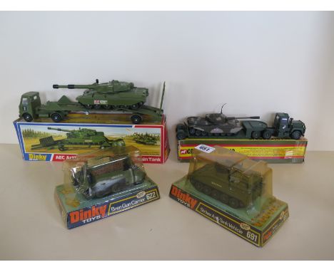 Three Dinky Toys military vehicles - AEC Artic Transporter with tank, Bren gun carrier, striker anti tank vehicle - all boxed