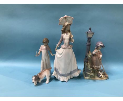 Two Lladro figures, a Lladro dog and a Nao figure of a girl