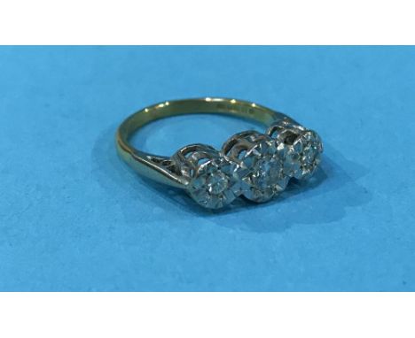 An 18ct three stone diamond ring, 3.5g, size 'M'