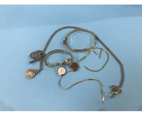 A ladies 9ct gold watch, a plated bangle etc