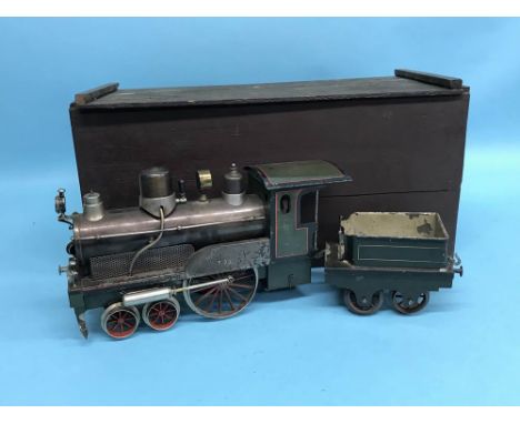 A boxed tinplate train engine and tender