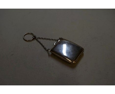 A silver match book case, by D Bros, Birmingham 1918, having gilded interior compartment and attached finger ring chain, 5.6c