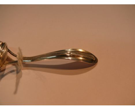 A Dutch white metal caddy spoon, having ribbed bowl, 8.7cm.
