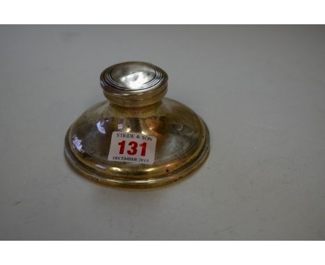 A silver capstan inkwell, base 10.8cm diameter. Condition Report: Side has a crease which is opening up, dented, hallmarks ru
