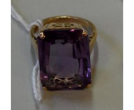 A 9ct gold cocktail ring set large rectangular amethyst. Condition Report: Overall condition is good, stone is without chips 