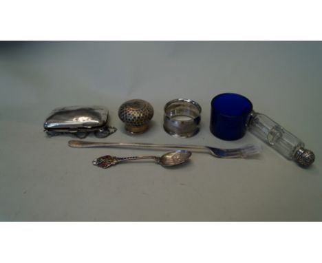 A silver purse, together with a silver pickle fork and four other items.