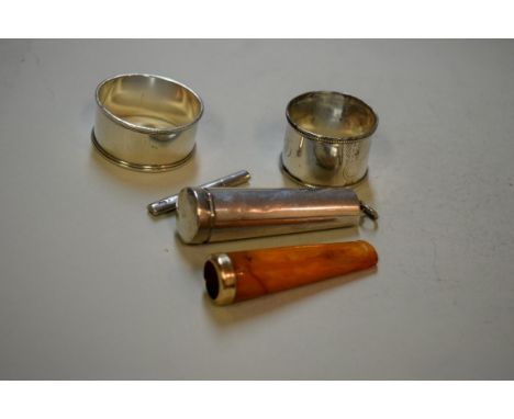 A Victorian silver cased amber cigar holder having 9ct gold band, (a/f), by Samuel M Levi, Birmingham 1896, together with two