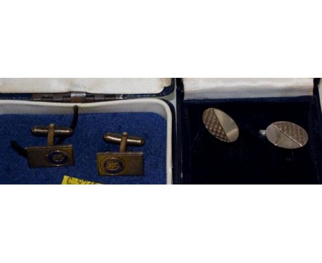 A pair of silver gilt and enamel Rotary International cufflinks; and another pair of silver cufflinks.