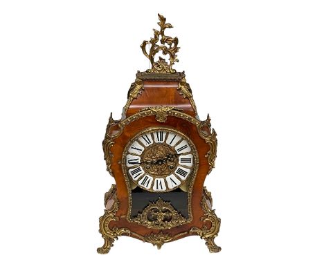 French style ornate walnut and gilt metal mounted mantel clock with enamel Roman numeral dial.