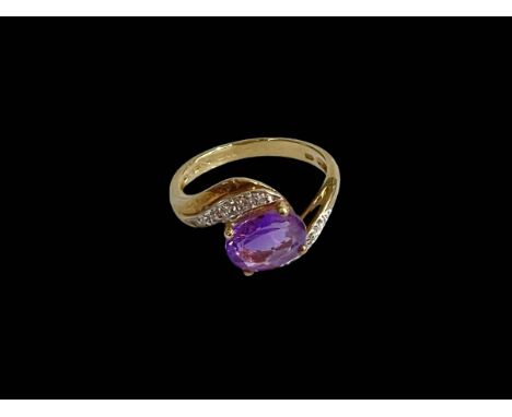 Amethyst and diamond 9 carat gold ring, size L.