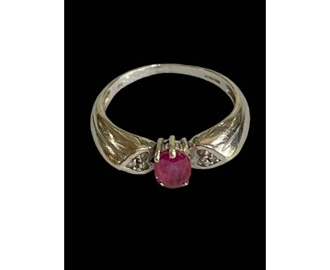 Ruby and diamond 9 carat white gold ring, size P.