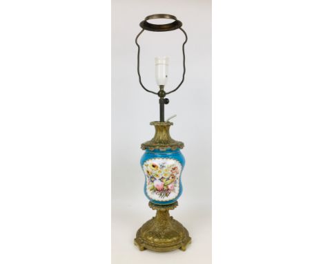 A 19th century continental Sevres style lamp vase, in pale blue with two floral reserves, gilt highlights, cast brass lamp fi