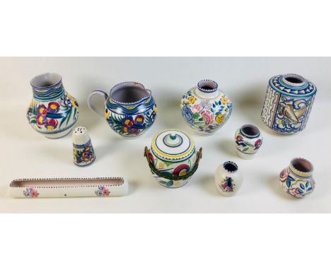 Ten pieces of Poole pottery, comprising six vases, largest 15 by 20cm high, 7 by 8.5cm high, a water jug, 23 by 15.5 by 15.8c